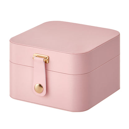 Closed Jelly Pink travel jewelry organizer with front strap and gold-tone snap closure.