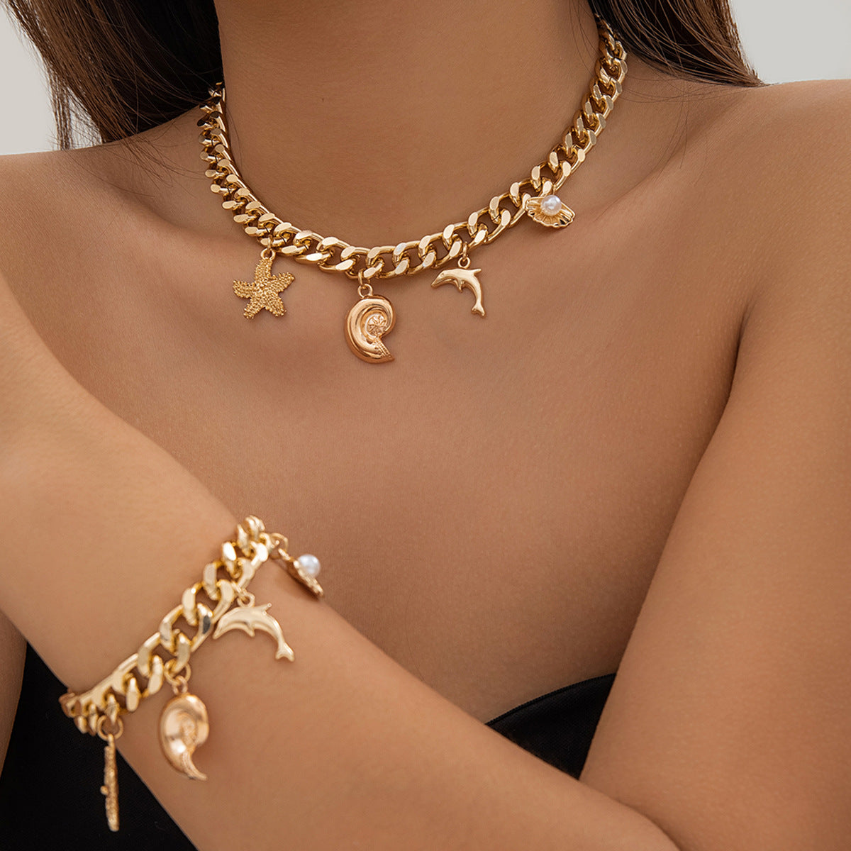 Gold coastal charm necklace and bracelet set
