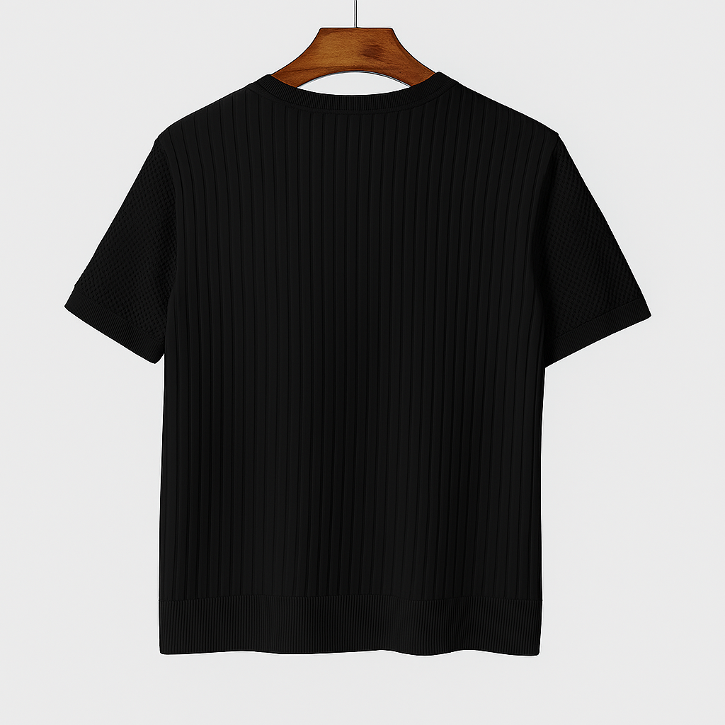 Back view of a black ribbed crew neck T-shirt with mesh short sleeves, hanging on a wooden hanger against a light gray background