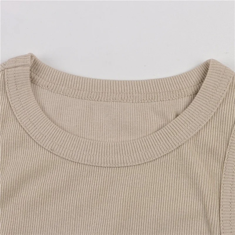 Close-up of a beige ribbed round neckline on a sleeveless top with clean stitching.