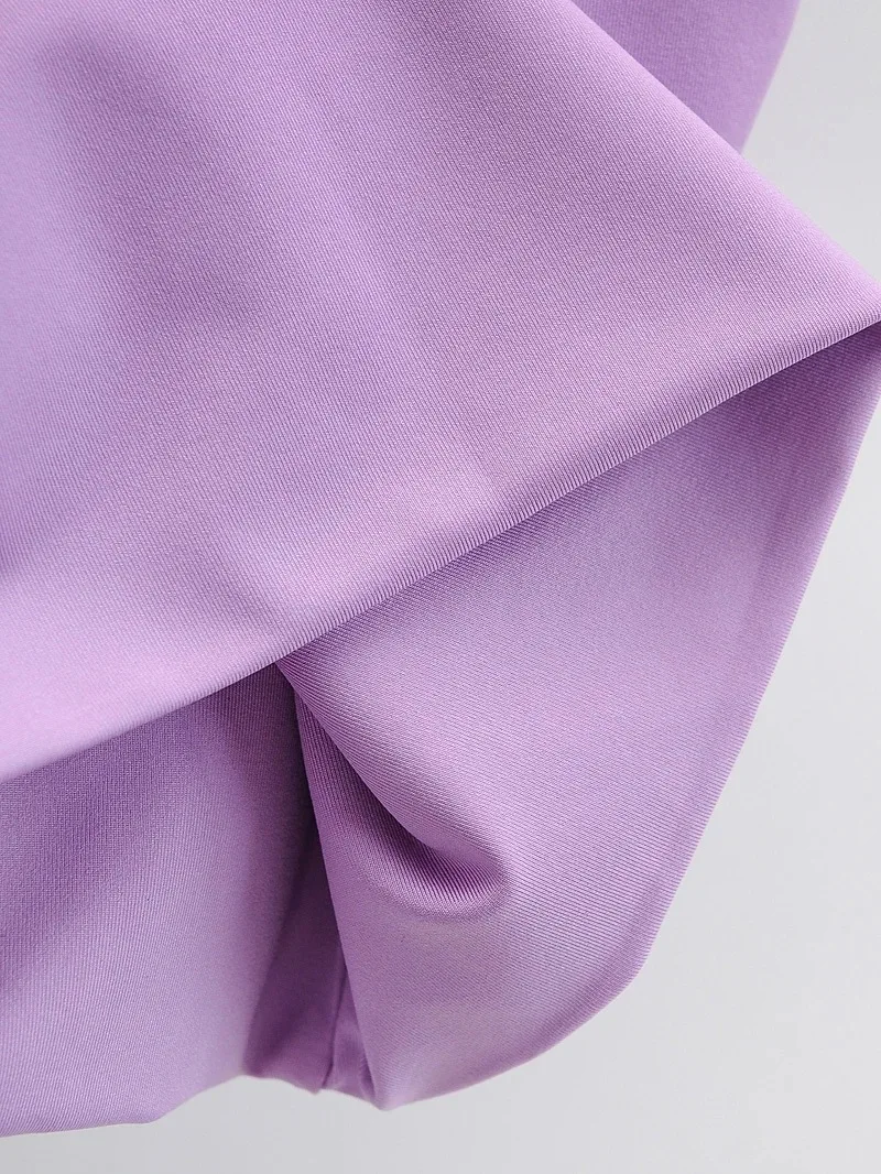 Close-up of folded lavender fabric with smooth texture and soft sheen.
